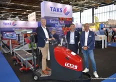 Arie Meeuwissen, Bert-Jan Nolden and Hans Fakkert of Taks Handling Systems. The Taksi is a powerful induction tractor that helps growers automatically transport crops without the need for labor.